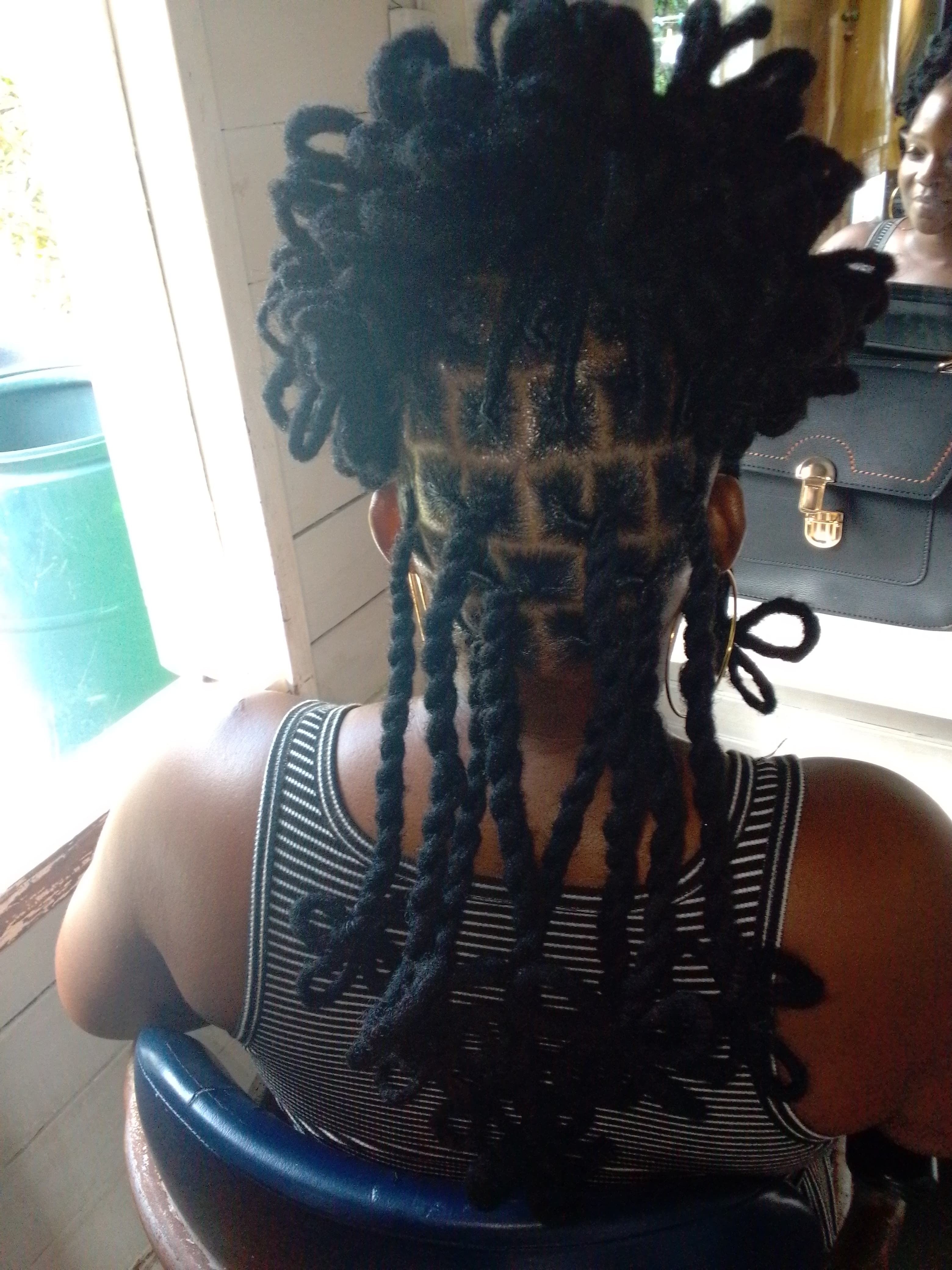Loc retwist and style... (Petals+butterfly ends)